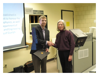 Barbara Hallett (right) presented Andrew Harris (left) with the Ross Hallett Memorial Graduate Scholarship.