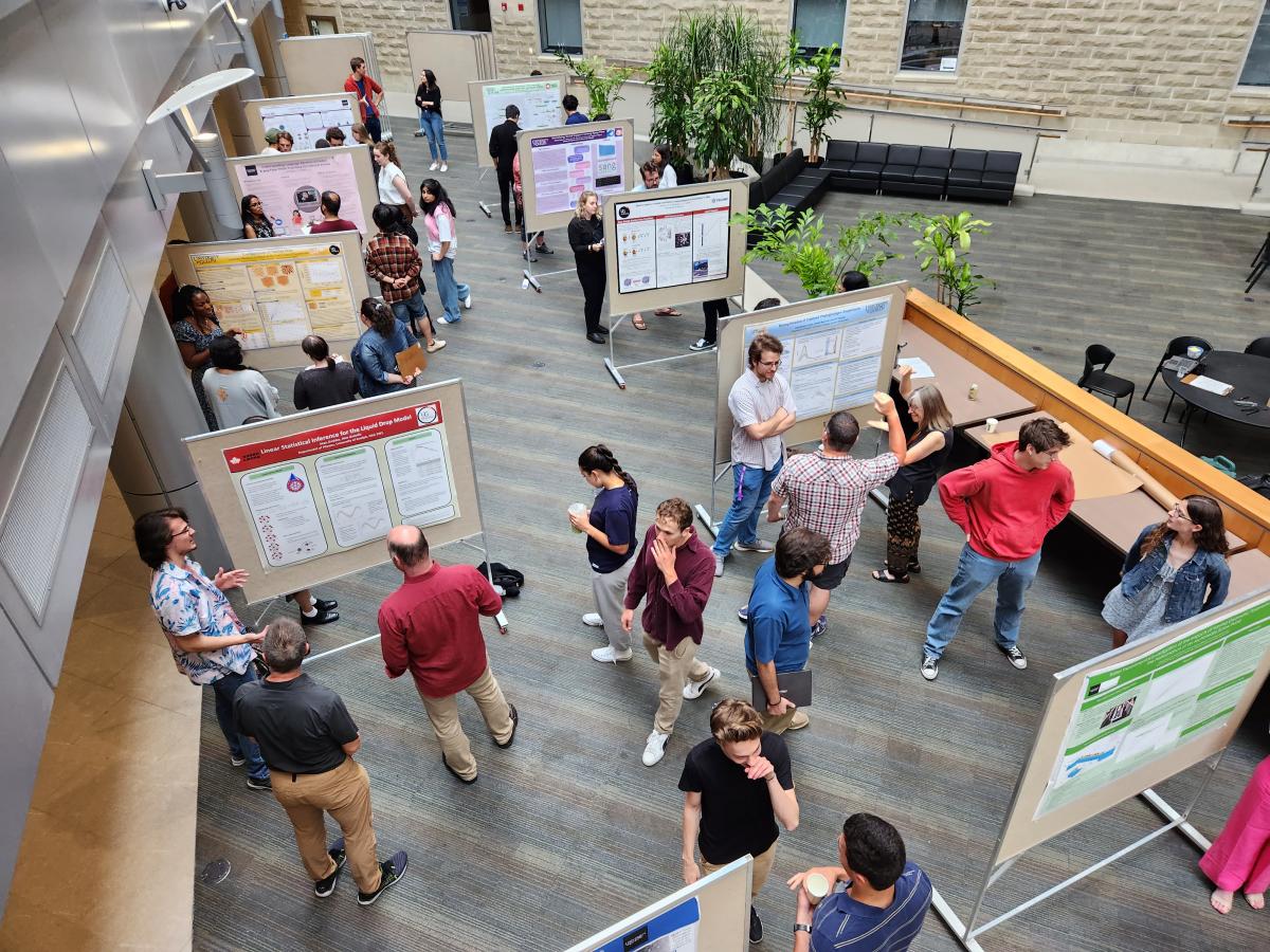 Aerial view of atrium where students present research posters to judges. 