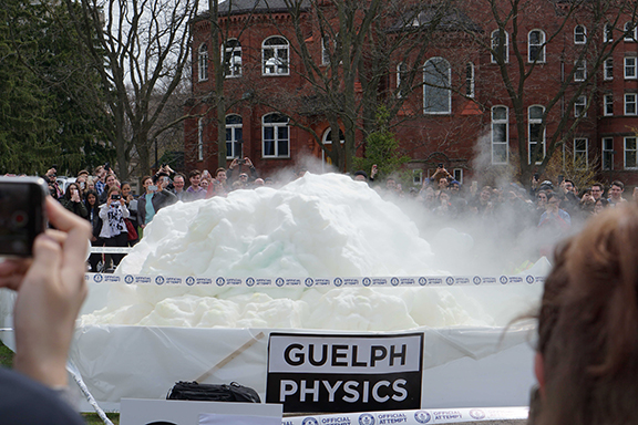 Group Outside watching Elephant Toothpaste World record attempt - huge pile of toothpaste