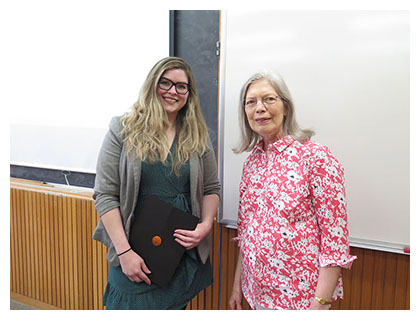 Rachel Munro (left) receiving Hallett Scholarship from Barbara Hallett (right)