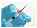 Gloved hand with needle for vaccine